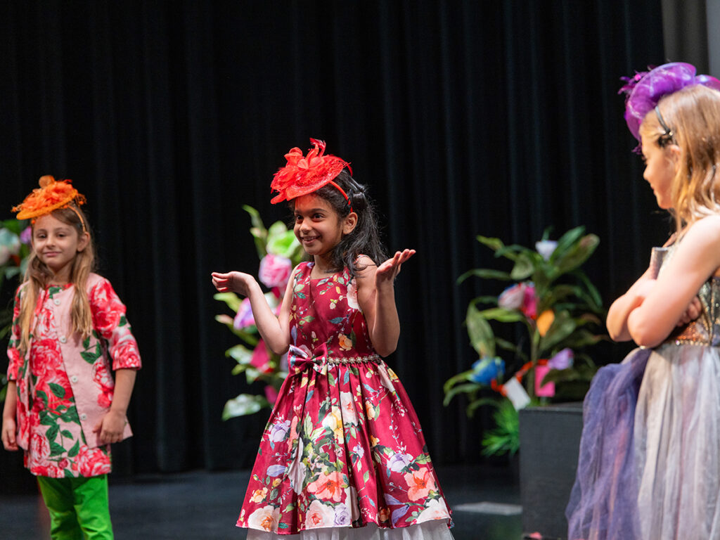 Students perform in a theater.