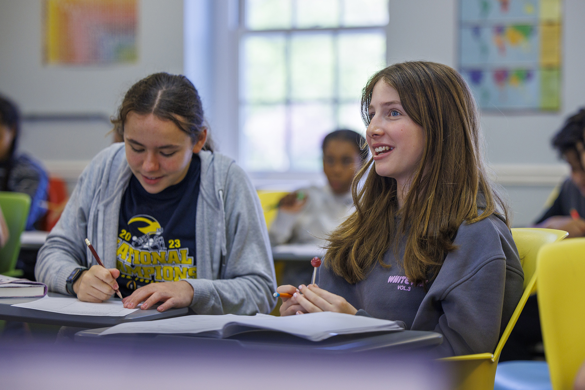 Two students sit in a math class.